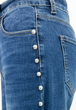 Load image into Gallery viewer, Blue denim jeans with silver studs – side detail.